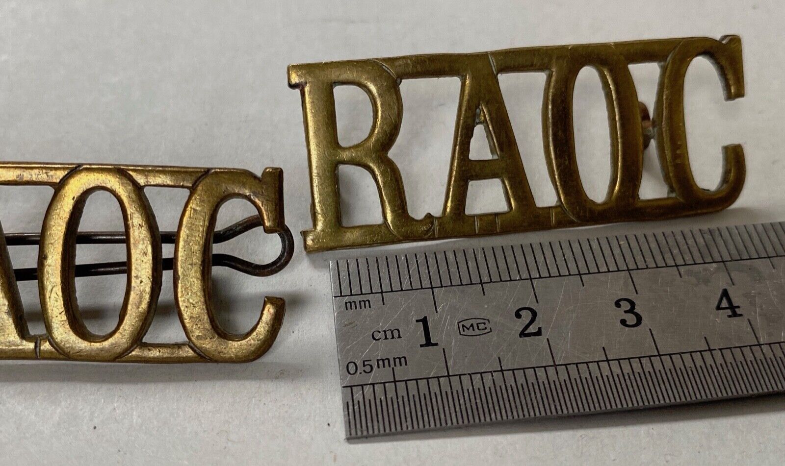 British Army WW1 RAOC Royal Army Ordnance Corps brass shoulder titles. - The Militaria Shop