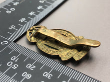 Load image into Gallery viewer, Original British Army WW2 RAOC Royal Army Ordnance Corps Cap Badge - The Militaria Shop