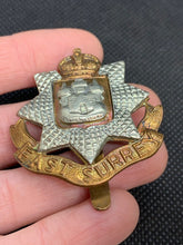 Load image into Gallery viewer, Original WW2 British Army East Surrey Kings Crown Brass Cap Badge - The Militaria Shop