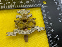 Load image into Gallery viewer, WW1 / WW2 British Army NORTH STAFFORD REGIMENT Brass and WM Cap Badge. - The Militaria Shop