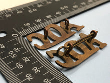 Load image into Gallery viewer, Original WW1 British Army Ordnance Corps (A.O.C.) Shoulder Titles - The Militaria Shop