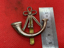 Load image into Gallery viewer, Original WW1 / WW2 British Army Light Infantry Volunteers Cap Badge - The Militaria Shop
