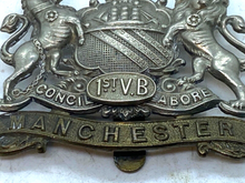 Load image into Gallery viewer, Original British Army WW1 1st Volunteer Battalion Manchester Regiment Cap Badge - The Militaria Shop