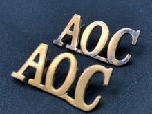 Load image into Gallery viewer, Original WW1 British Army Brass Shoulder Titles - Army Ordnance Corps AOC - The Militaria Shop