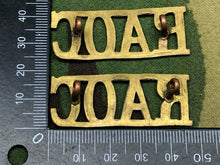 Load image into Gallery viewer, Original WW2 British Army Brass Shoulder Titles - RAOC Royal Army Ordnance Corps - The Militaria Shop