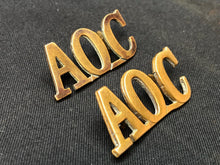 Load image into Gallery viewer, Original WW1 British Army Brass Shoulder Titles - Army Ordnance Corps AOC - The Militaria Shop