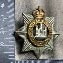 Load image into Gallery viewer, Original WW1 British Army The Devonshire Regiment Cap Badge - The Militaria Shop
