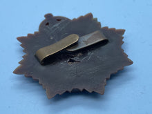 Load image into Gallery viewer, Original WW2 British Army GVI Royal Army Service Corps Plastic Economy Cap Badge - The Militaria Shop