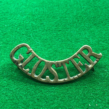 Load image into Gallery viewer, Original WW1 British Army Brass Shoulder Title - Gloster - The Militaria Shop