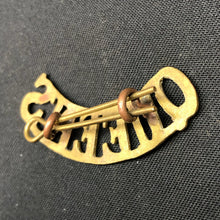 Load image into Gallery viewer, Original WW1 British Army Brass Shoulder Title - Queen's - The Militaria Shop