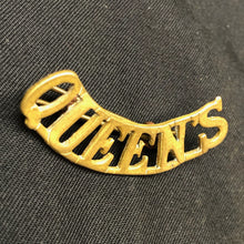 Load image into Gallery viewer, Original WW1 British Army Brass Shoulder Title - Queen's - The Militaria Shop