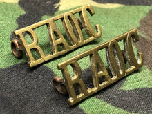 Load image into Gallery viewer, Original WW2 British Army Brass Shoulder Titles - RAOC Royal Army Ordnance Corps - The Militaria Shop