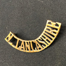 Load image into Gallery viewer, Original WW1 British Army Brass Shoulder Title - North Lancashire - The Militaria Shop