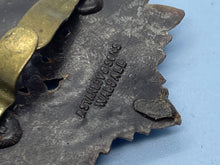 Load image into Gallery viewer, Original WW2 British Army GVI Royal Army Service Corps Plastic Economy Cap Badge - The Militaria Shop