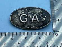Load image into Gallery viewer, Vintage G A Initials on World Map Metal Badge - 'Whatsoever' on Reverse - The Militaria Shop