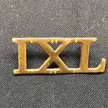 Lade das Bild in den Galerie-Viewer, Original WW1 British Army Brass Shoulder Title - 9th Lancers IXL Regiment - The Militaria Shop
