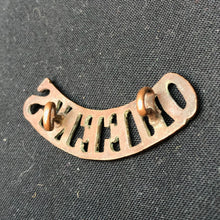 Load image into Gallery viewer, Original WW1 British Army Brass Shoulder Title - Queen's Regiment - The Militaria Shop