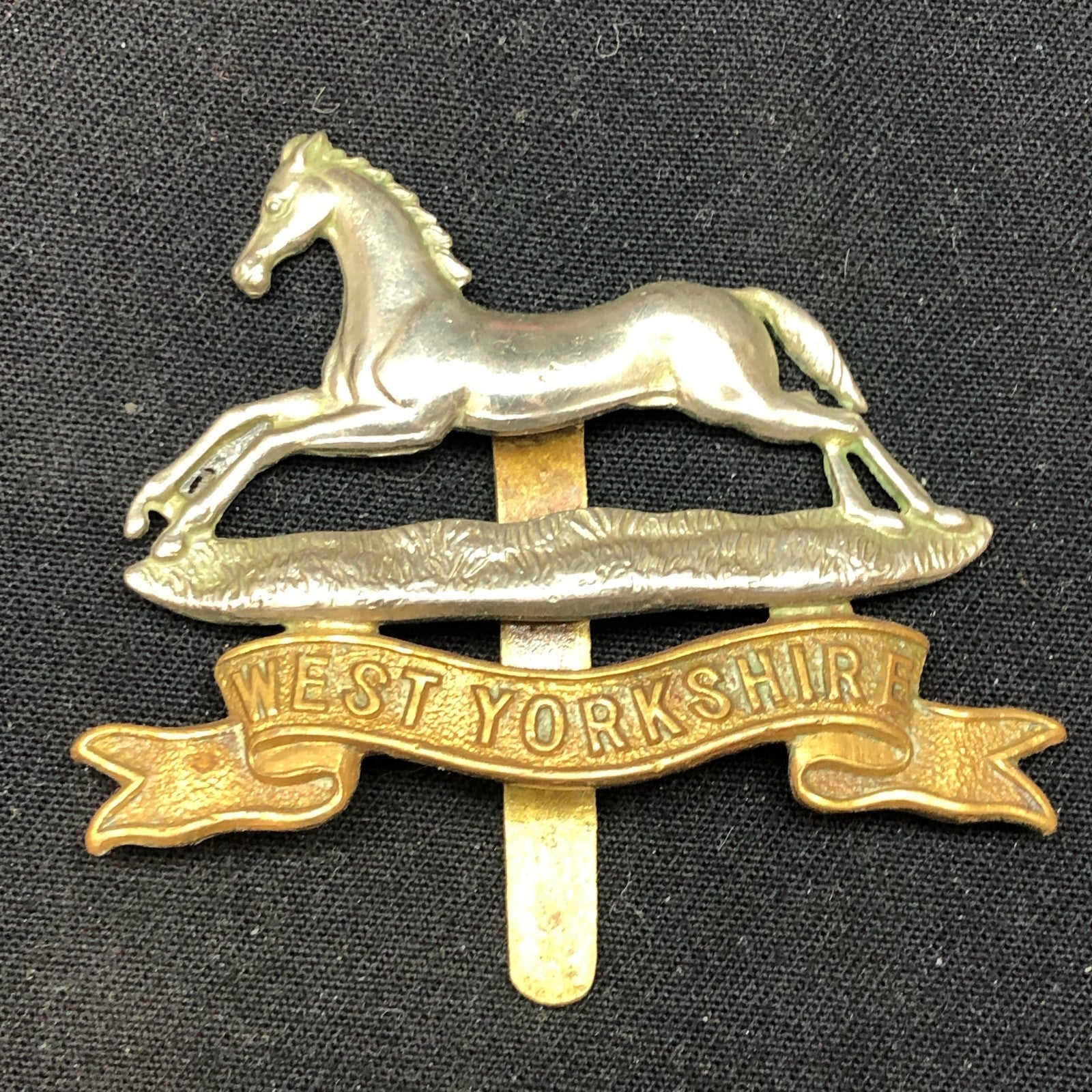 Genuine WW2 British Army Brass Cap Badge - West Yorkshire Regiment - The Militaria Shop