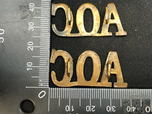 Load image into Gallery viewer, Original WW1 British Army Brass Shoulder Titles - Army Ordnance Corps AOC - The Militaria Shop
