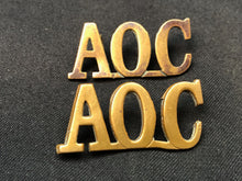 Load image into Gallery viewer, Original WW1 British Army Brass Shoulder Titles - Army Ordnance Corps AOC - The Militaria Shop