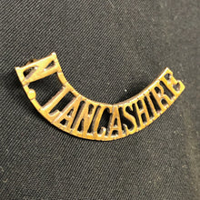 Load image into Gallery viewer, Original WW1 British Army Brass Shoulder Title - North Lancashire - The Militaria Shop