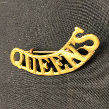 Load image into Gallery viewer, Original WW1 British Army Brass Shoulder Title - Queen's - The Militaria Shop