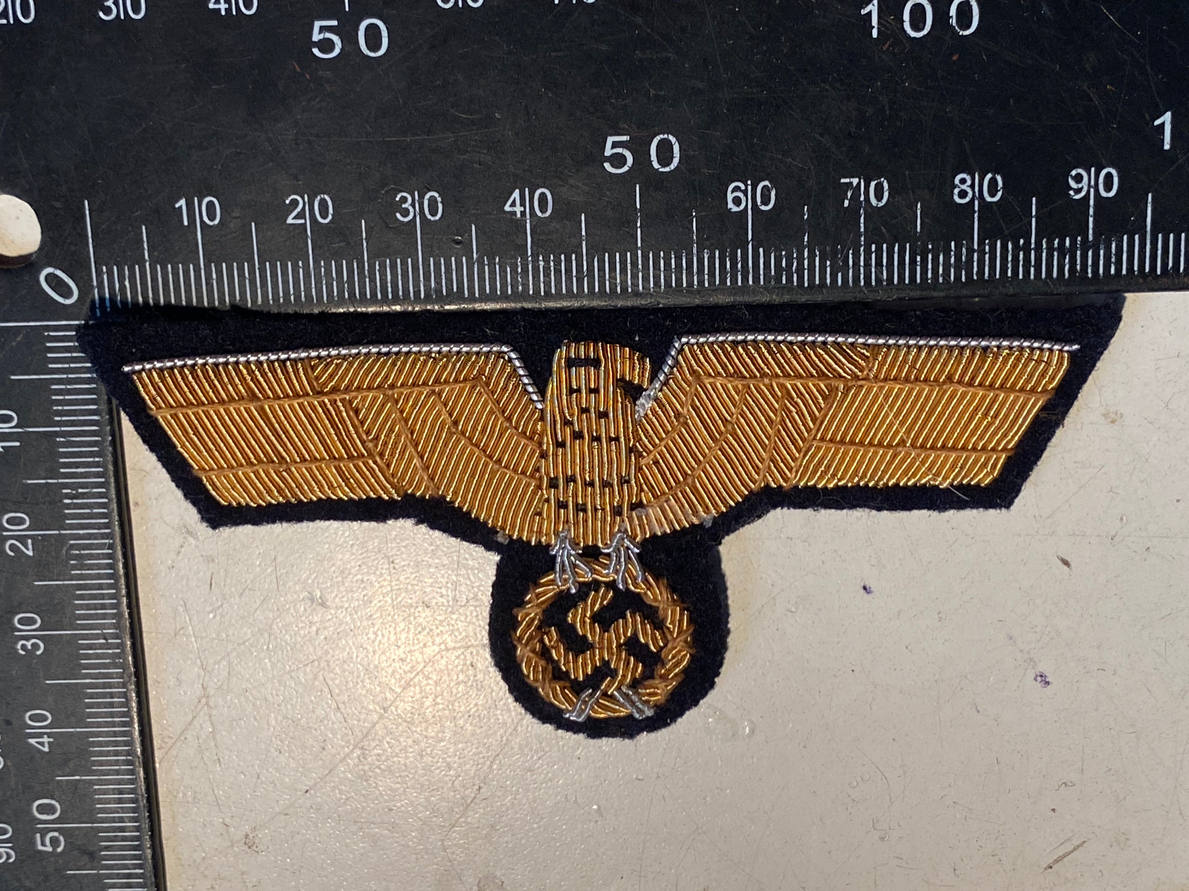 A good reproduction WW2 German Kriegsmarine Officer's Tunic Eagle. - The Militaria Shop