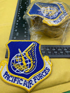 An original US Air Force PACIFIC AIR FORCES Patch/Badge. Brand New - Unissued. - The Militaria Shop