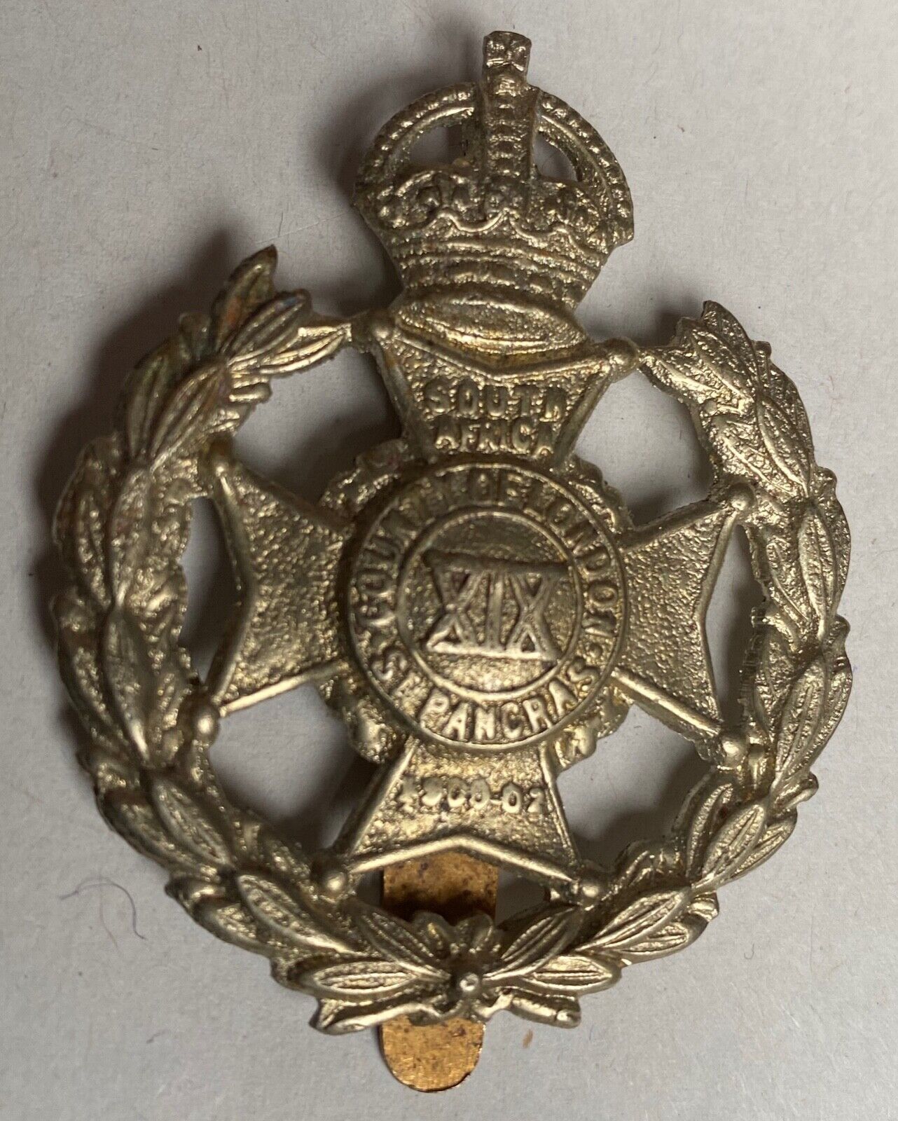 A British Army 19th County of London white metal cap badge. - The Militaria Shop
