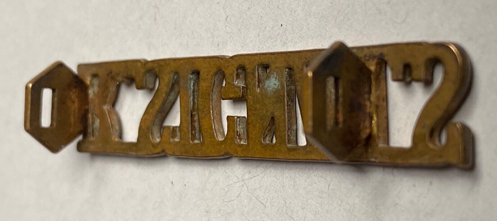 A WW1 British Army Royal Signals brass shoulder title. - The Militaria Shop