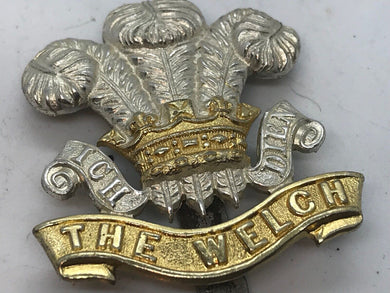 A silver & gilt washed THE WELSH Regiment dress cap badge with slider --- B1 - The Militaria Shop