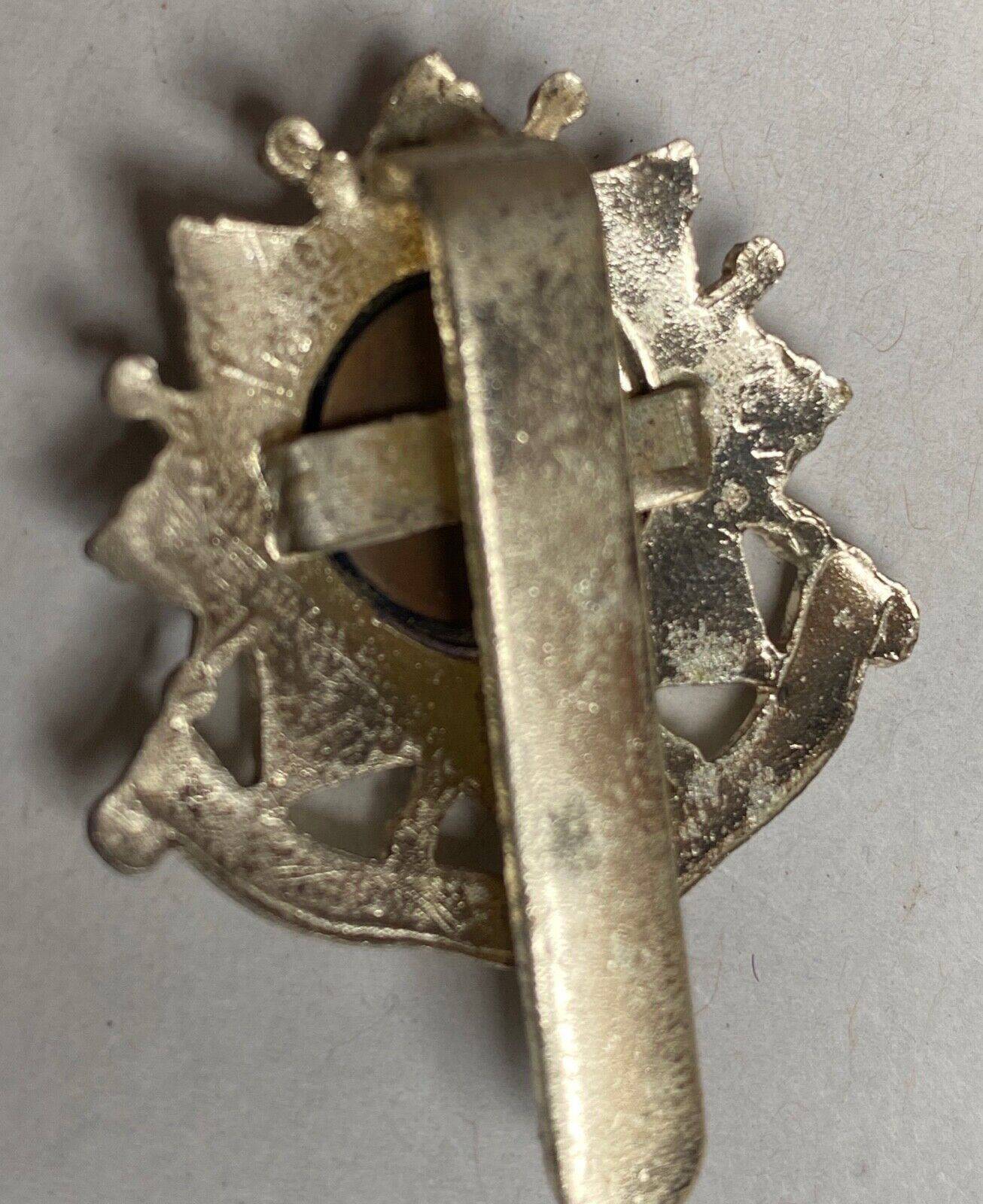 A white metal British Army Bedfordshire & Hertfordshire Regiment cap badge. - The Militaria Shop