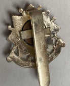 A white metal British Army Bedfordshire & Hertfordshire Regiment cap badge. - The Militaria Shop