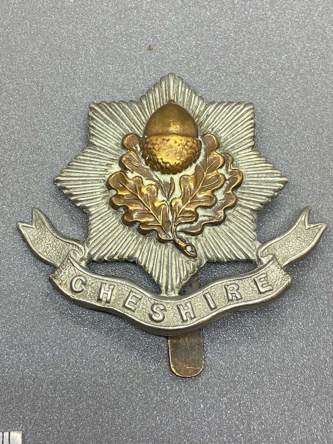 Good original WW1 British Army Cheshire Regiment Cap Badge