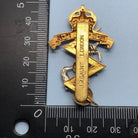 Genuine British Army Cap Badge - Royal Electrical and Mechanical Engineers - The Militaria Shop