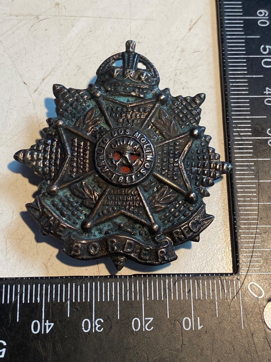 Original British Army WW1 / WW2 Border Regiment Blackened Cap Badge