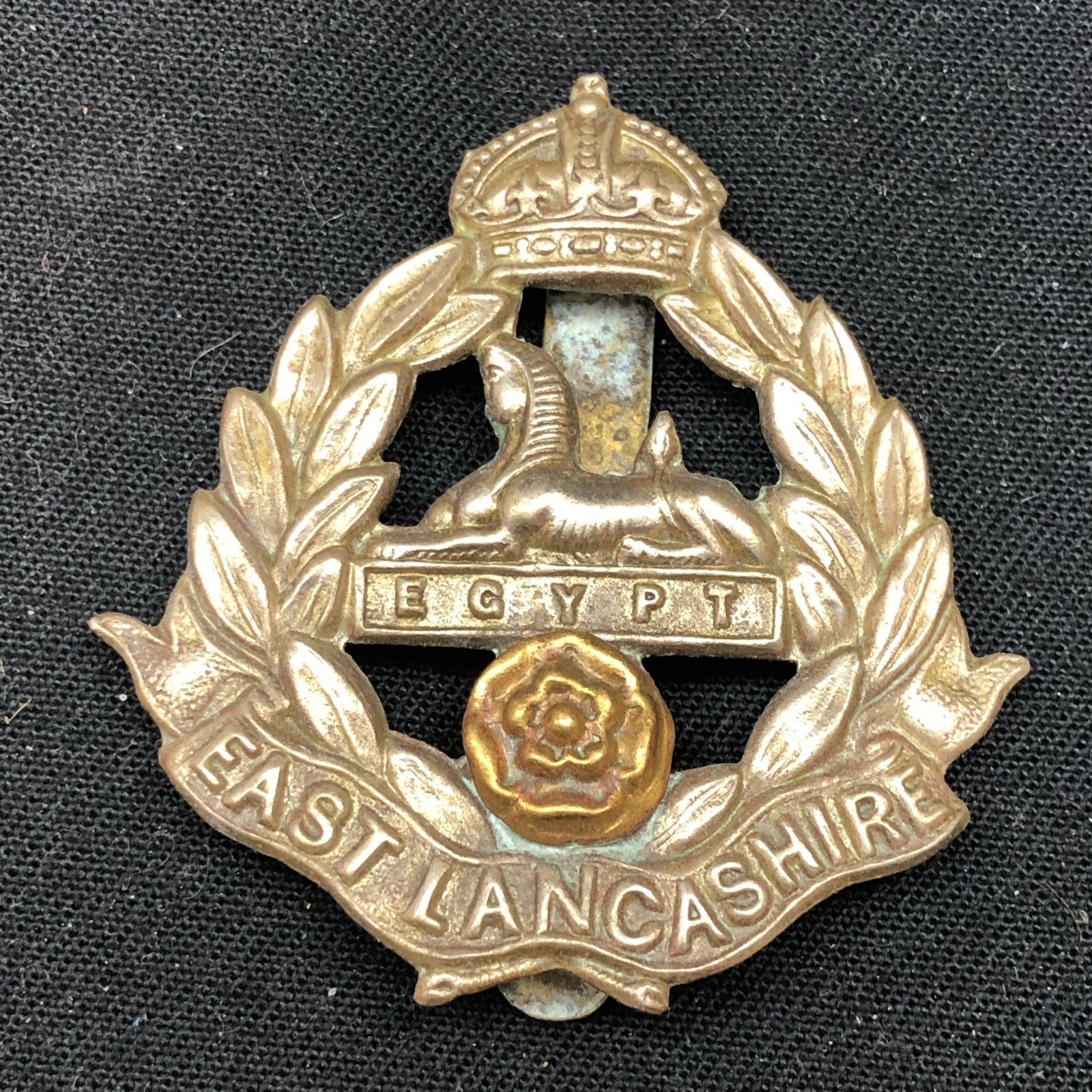 Genuine WW2 British Army Brass Cap Badge - East Lancashire Regiment - The Militaria Shop