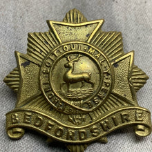 Load image into Gallery viewer, Original WW1 British Army Bedfordshire Regiment Cap Badge - Rare Brass Variation
