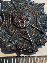 Load image into Gallery viewer, Original British Army WW1 / WW2 Border Regiment Blackened Cap Badge
