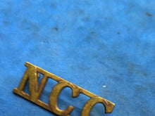 Load image into Gallery viewer, Original WW2 British Army Non Combatant Corps (N.C.C.) Brass Shoulder Title
