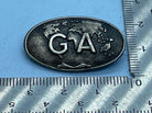Vintage G A Initials on World Map Metal Badge - 'Whatsoever' on Reverse - The Militaria Shop