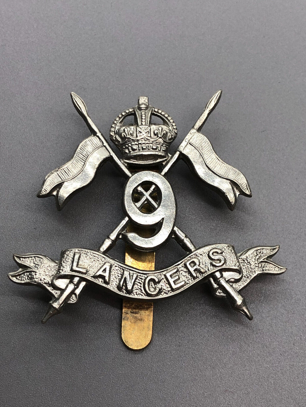 Original WW1 British Army 9th Queen’s Royal Lancers Cap Badge