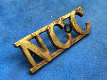 Load image into Gallery viewer, Original WW2 British Army Non Combatant Corps (N.C.C.) Brass Shoulder Title
