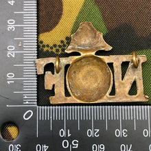 Load image into Gallery viewer, Genuine British Army WW1 Brass Shoulder Title - Northumberland Fusiliers - The Militaria Shop
