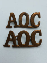 Load image into Gallery viewer, Original WW1 British Army Ordnance Corps (A.O.C.) Shoulder Titles
