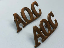 Load image into Gallery viewer, Original WW1 British Army Ordnance Corps (A.O.C.) Shoulder Titles
