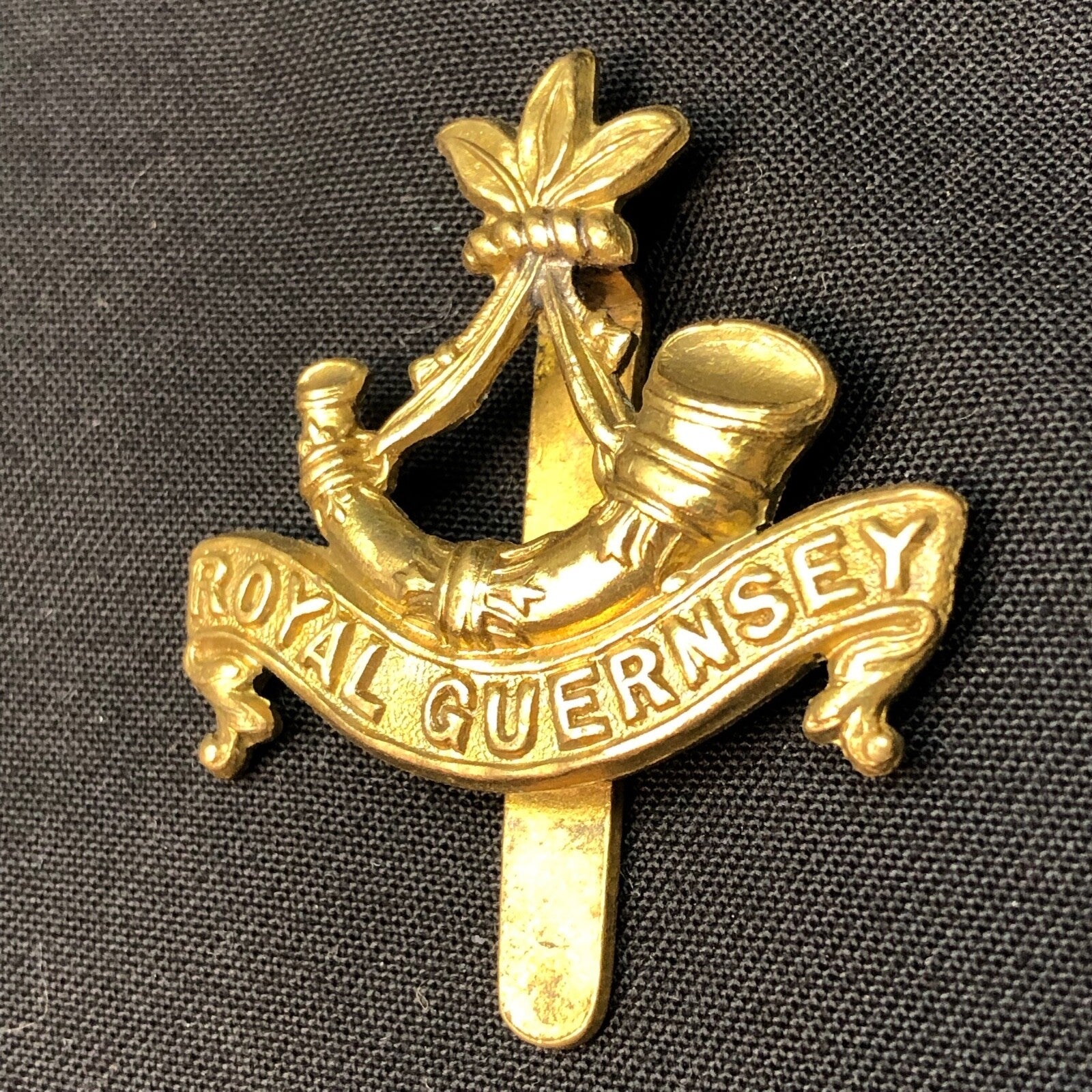 Original British Army WW1 Royal Guernsey Light Infantry Cap Badge - The Militaria Shop