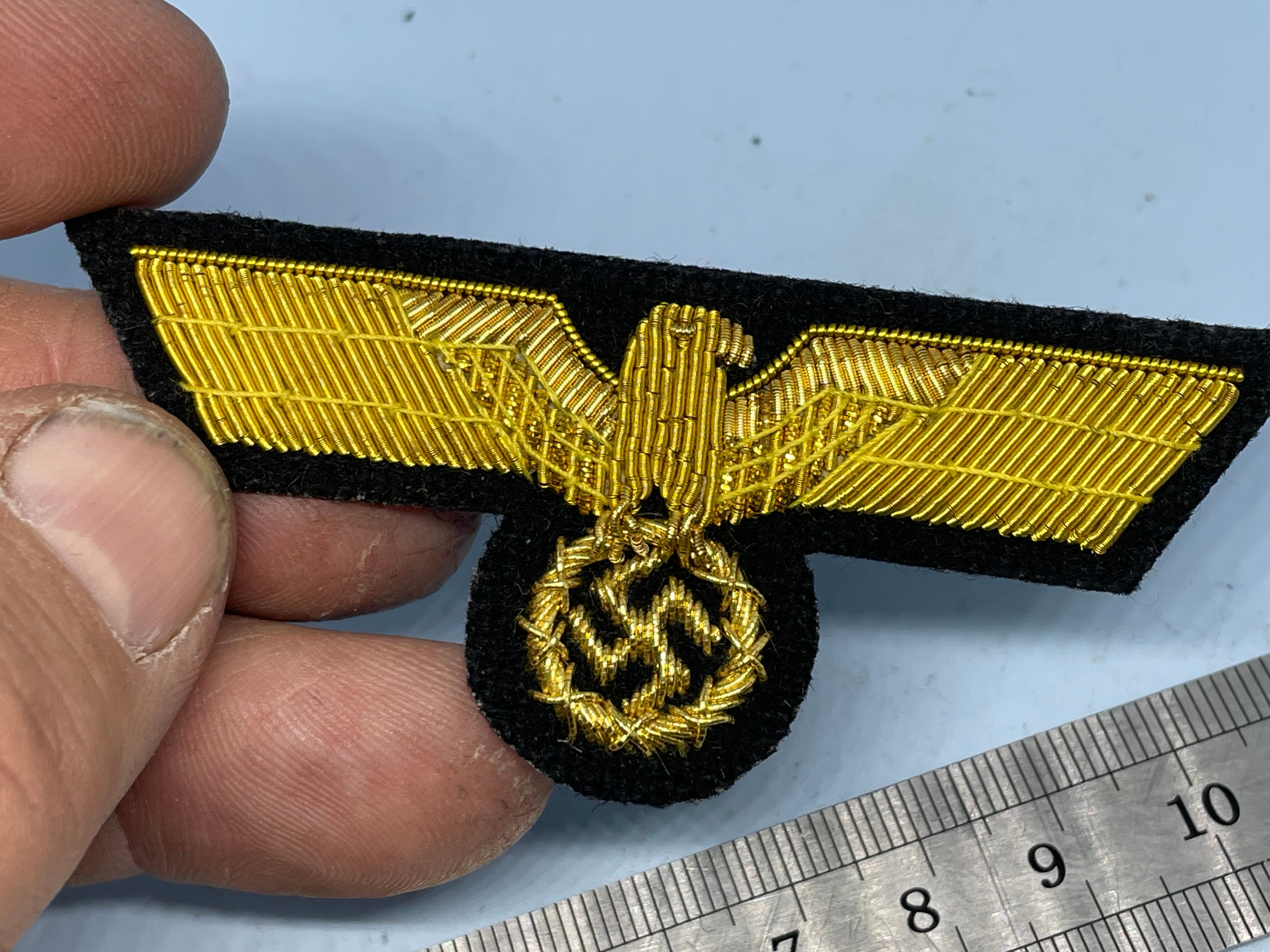 Reproduction WW2 German Kriegsmarine Officer's Bullion Breast Eagle on a black background - The Militaria Shop