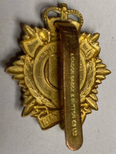 Load image into Gallery viewer, A gilt metal British Army Logistics Corps cap badge.
