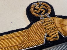 Load image into Gallery viewer, A good reproduction WW2 German Kriegsmarine Officer's Tunic Eagle. - The Militaria Shop
